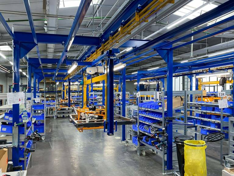 AS-Motor factory, new product line is open: AS 1000 Ovis EVO RC. Wide shot of the assembly line