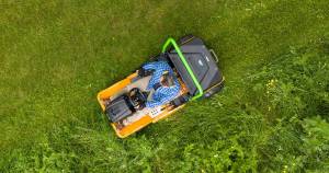 birdseye top-down-view shot of a AS-Motor AS 920 E-Sherpa 2WD mowing tall grass on a lawn